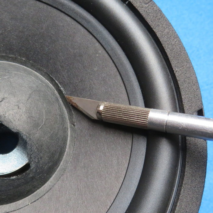 Speaker dust cap replacement - remove the old dust cap using a small, good, hobby knive